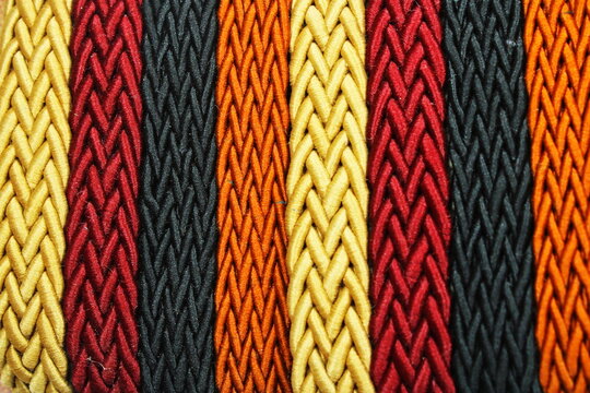 Close Up Of Colorful Interwoven Shiny Textile Cords Background Patterns