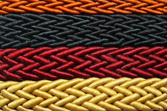 Close Up Of Colorful Interwoven Shiny Textile Cords Background Patterns