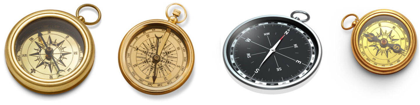 Four compasses, two antique brass and two modern, isolated on a white background