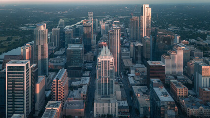 Obraz premium Aerial view of downtown Austin skyscrapers and city streets at dusk, Texas