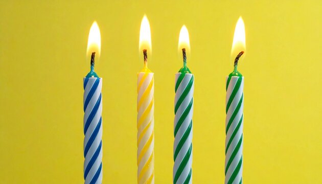 Three Spiral Birthday Candles Isolated yellow background
