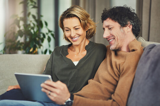 Relax, streaming and tablet with happy couple on sofa in home living room for subscription signup. App, download and smile with mature people in apartment together for online membership options