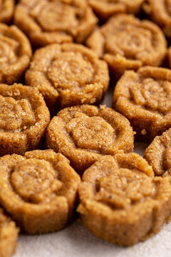 Appetizing traditional kazakh zhent sweet dessert shaped in patterned portions close up