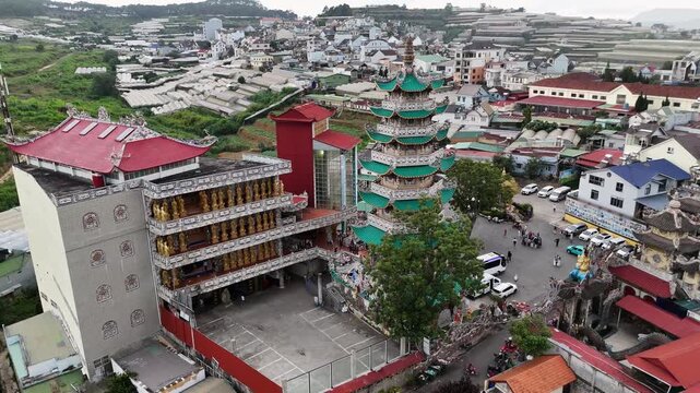 Aerial view of Linh Phuoc Pagoda with greenhouses around it, Dalat, Vietnam.
