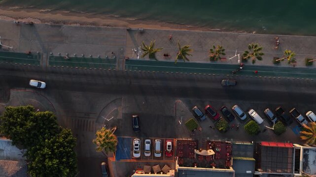 Aerial top down view of the Malecon boardwalk in La Paz at golden hour