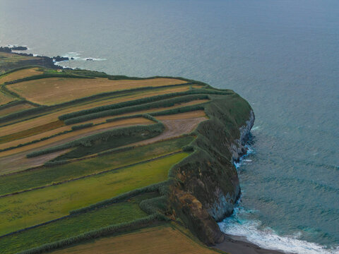 Coastal cliff with patchwork fields above the Atlantic Ocean, Azores
