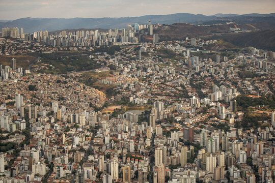 Aerial view of the sprawling cityscape of Belo Horizonte with dense residential buildings, high-rise towers, and urban infrastructure in Belo Horizonte, Minas Gerais, Brazil.