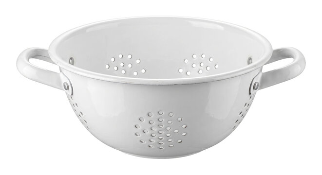 Classic white enamel metal colander with two handles and drainage holes is isolated on a clean white background