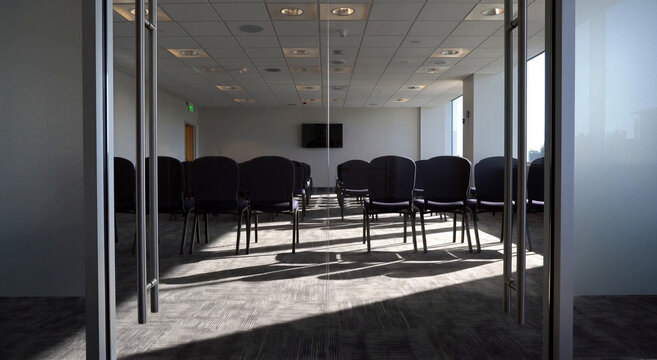 Empty conference room with chairs and sunlight