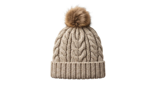 Cozy beige knitted winter hat with a fluffy brown pompom on top, isolated on a clean white background