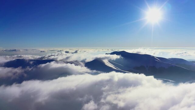 Wonderful view of extraordinary cloudy valley and bright orange sunset