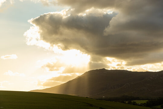 god like sunrays beaming down on farmland and vineyards, Stanford, South Africa