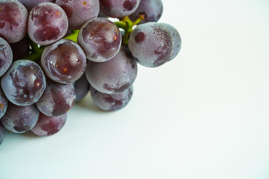 Fresh Purple Grapes with Natural Bloom on White Background, Close up View