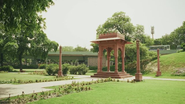 Cinematic video of Vasudev Ghat along the Yamuna River in Delhi, featuring riverside steps, landscaped gardens, traditional architectural elements, and peaceful surroundings. A scenic Delhi tourism.