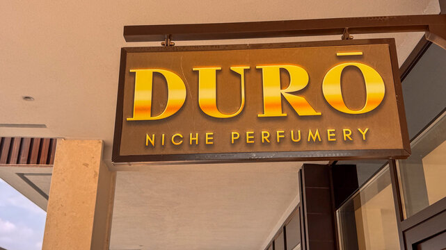 15.09.2026,Porto Montenegro.A close-up of the illuminated Duro Niche Perfumery sign at the boutique in Porto Montenegro, Tivat, featuring warm golden tones.
