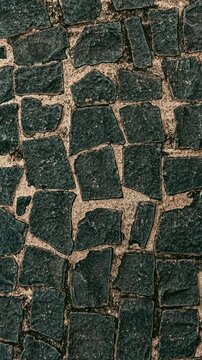 Dark cobblestone ground texture pattern