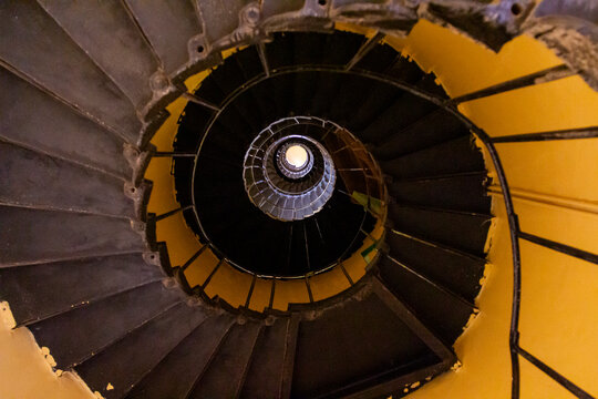 A spiral staircase winds downward inside the Sanganeb reef lighthouse, Red Sea State, Sanganeb, Sudan