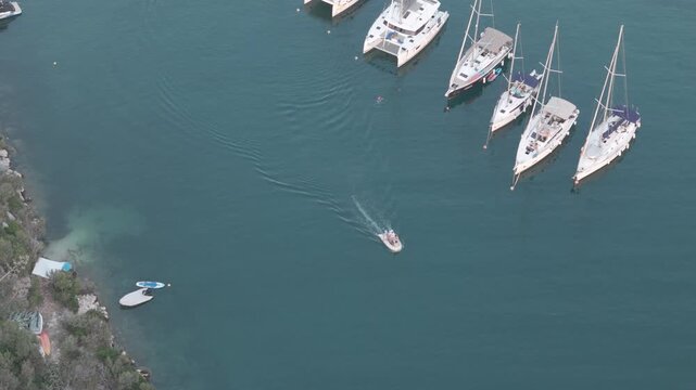 Yachts anchored in line in quiet Adriatic bay