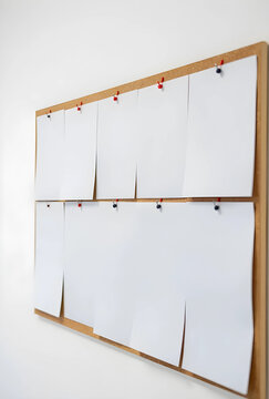 Planning and organization concept blank paper sheets pinned on a cork board for project management brainstorming and office communication strategy