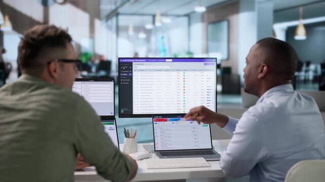 Internal Auditor And IT Specialist Review Automated Compliance System