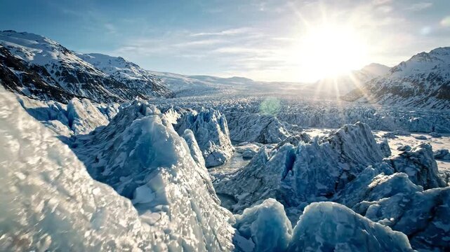 Dramatic glacial landscape with jagged ice formations under bright sunlight and blue sky