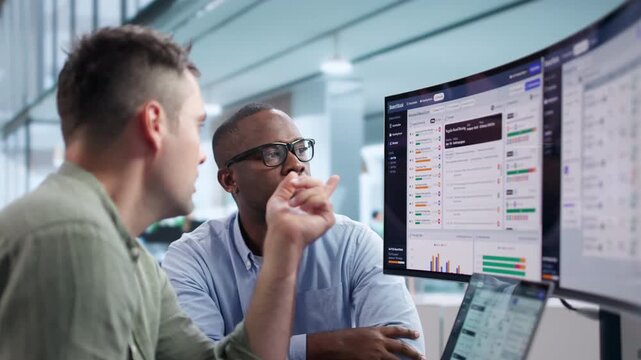 Corporate Manager Discussing Software Platform During Board Meeting