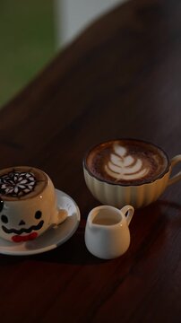 Halloween Coffee Set with Ghost Cup, Latte Art and Milk Creamer on Wooden Table