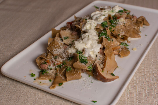 Chestnut Tagliatelle with Pork Rag&ugrave;, Porcini Mushrooms and Buffalo Stracciatella