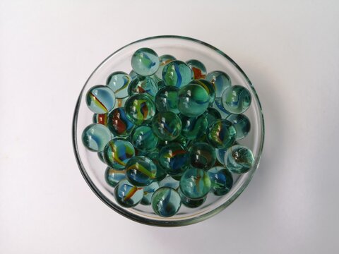 a collection of glass marbles for children to play with