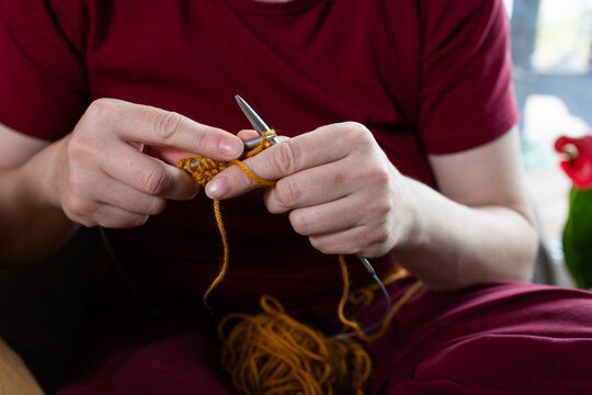 Mindful crafting with a close view of hands knitting