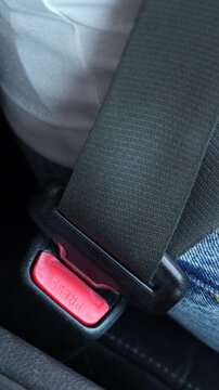 Close Up of people hand fastening seat safety belt in car for safety before driving on the road. concept transport travel. soft focus.