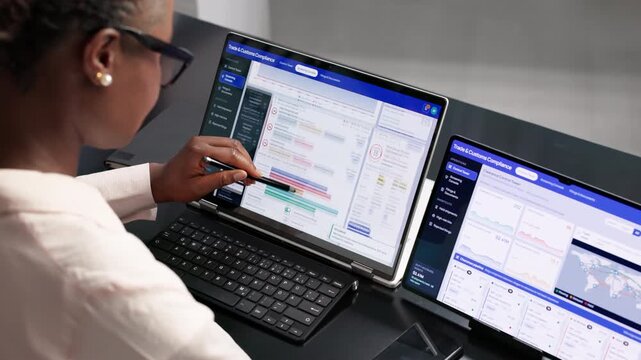 Trade Compliance Officer Carefully Reviews Import Documentation