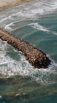 Aerial View of Rock Breakwater at Ocean Beach Coast