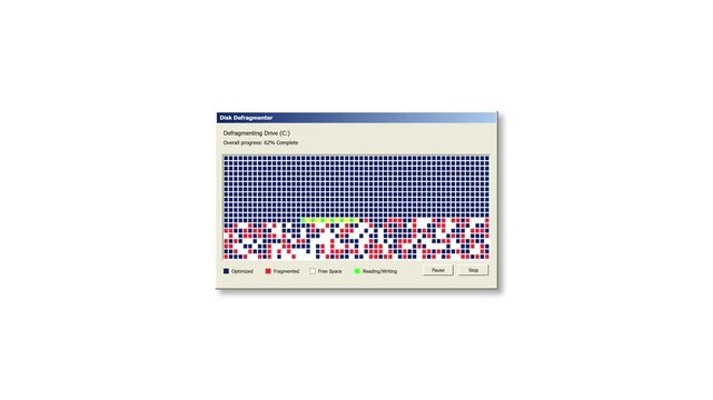 Retro interface of a classic computer disk defragmenter showing progress with blue red and white blocks for data storage optimization