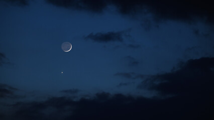 Blue hour time with crescent Moon, stars and planets. © astrosystem