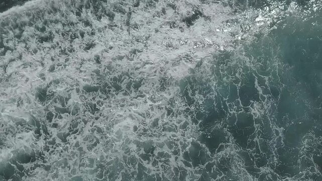 Foamy waves seen directly from above