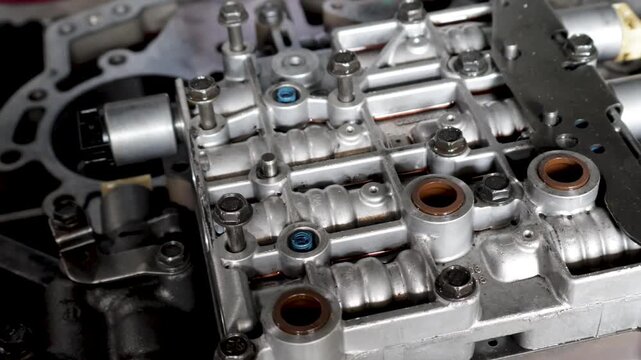 Close up view of automatic transmission valve body assembly in mechanical workshop.