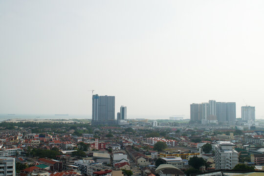 Hazy city skyline in Malaysia, representing transboundary haze, air pollution, poor air quality, environmental issues, reduced visibility, and regional pollution.