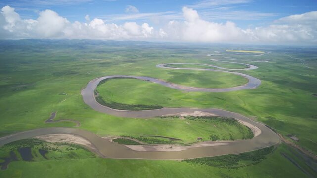High-Angle Aerial Panoramic View of Meandering River and Sea of Clouds in Zoige Wetland: Yellow River Upper Reaches, Winding Stream, Green Prairie, Blue Sky and Cloud Background