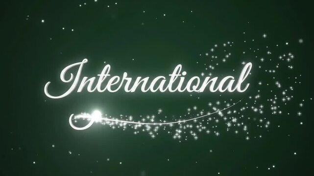 Glowing script writes International word on green background
