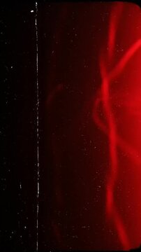 Vertical red light shines with intensity, creating a striking visual with gradual shifts and patterns, highlighting the dynamic nature of light itself
