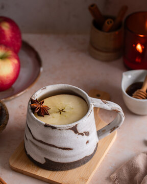 Autumn apple cider with star anise, cozy hot drink with honey