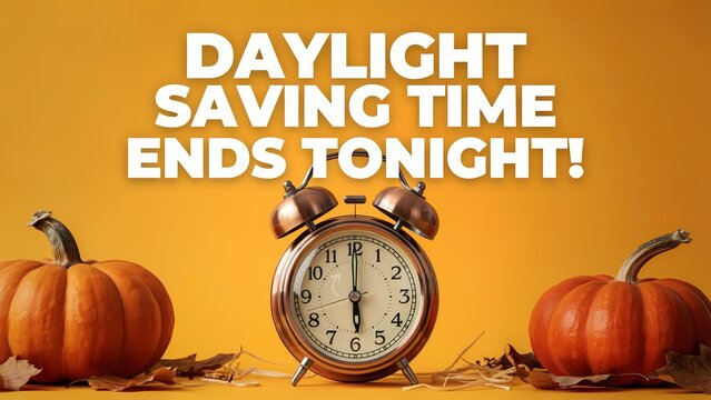 Daylight saving time ends tonight concept with an alarm clock and pumpkins on an orange background