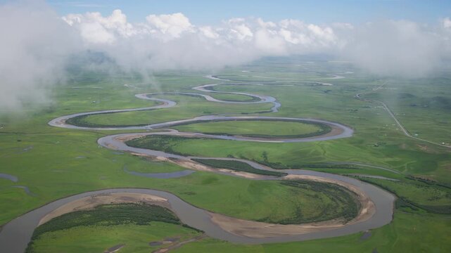 High-Angle Aerial Panoramic View of Meandering River and Sea of Clouds in Zoige Wetland: Yellow River Upper Reaches, Winding Stream, Green Prairie, Blue Sky and Cloud Background