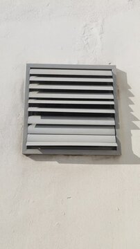 Industrial Ventilation System Louver Exhaust Working on Exterior Wall
