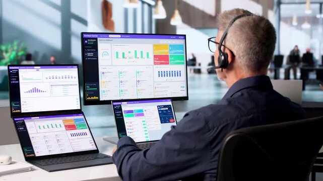 Call Center Agent Monitors Customer Support Dashboard