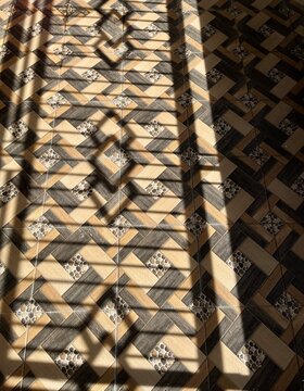 Geometric pattern floor runner on floor inside modern interior corridor