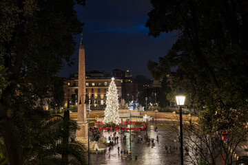 High angle view of illuminated Christmas tree and Flaminio obelisk on Piazza del Popolo at night in Rome Italy © Anatolii Tershak