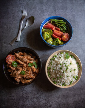 Full meal rice chicken and vegetables.