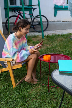 A satisfied teenager enters credit card details.